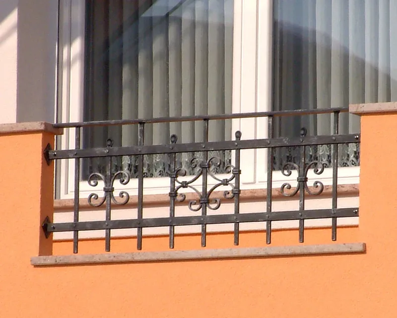 Wrought iron railings in wall niches on a balcony, Šenčur