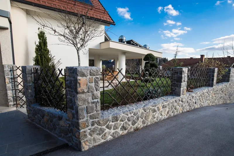 Modern wrought iron courtyard gate and fence, Ljubljana